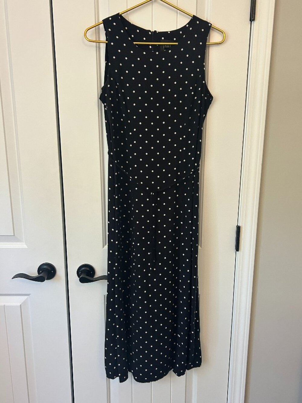 Teddi 12P black and white polka dot rayon dress with a classic zipper closure